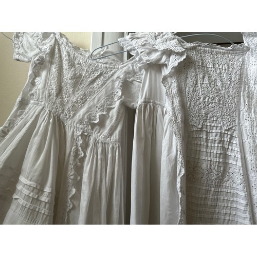 1061 - Five late 19thC/ 20thC christening gowns with panelled broderie anglaise together with an underskirt... 