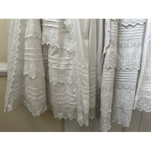 1061 - Five late 19thC/ 20thC christening gowns with panelled broderie anglaise together with an underskirt... 