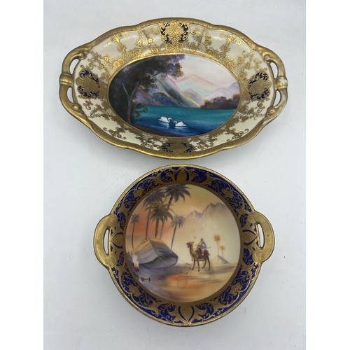 279 - Two Noritake dishes, one with gilt and lake scene  26.5 19cm and gilt and desert scene to the other.