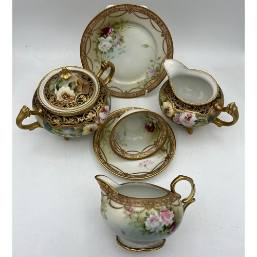 282 - Two Noritake jugs, lidded sucrier and a cup, saucer and plate.