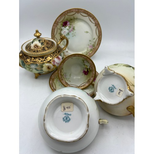 282 - Two Noritake jugs, lidded sucrier and a cup, saucer and plate.