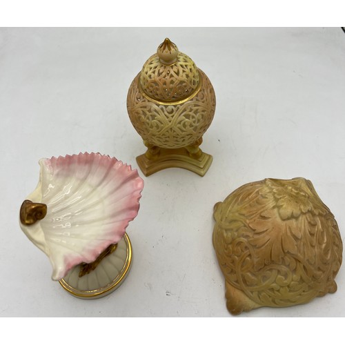 286 - Three pieces of Grainger Worcester to include dolphin and shell 10cm h, reticulated lidded jar and a... 