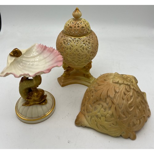 286 - Three pieces of Grainger Worcester to include dolphin and shell 10cm h, reticulated lidded jar and a... 