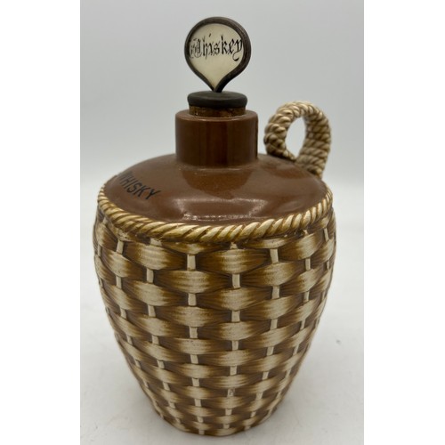 289 - A Taylor Tunnicliffe and Co realistically modelled wicker basket whisky flagon. 20cm h.