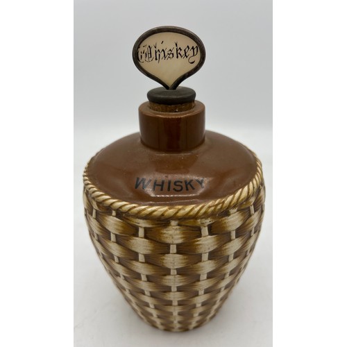 289 - A Taylor Tunnicliffe and Co realistically modelled wicker basket whisky flagon. 20cm h.