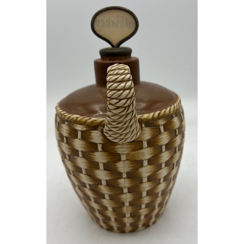 289 - A Taylor Tunnicliffe and Co realistically modelled wicker basket whisky flagon. 20cm h.