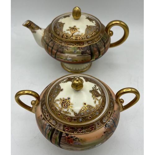 298 - A Nippon hand painted moriage teapot and lidded sucrier.