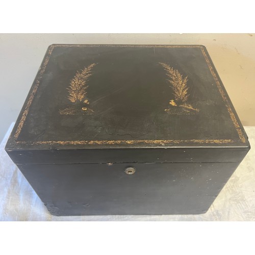 732 - A 19thC Chinese export black lacquer tea chest, top decorated with faded gilt figures and foliate wi... 