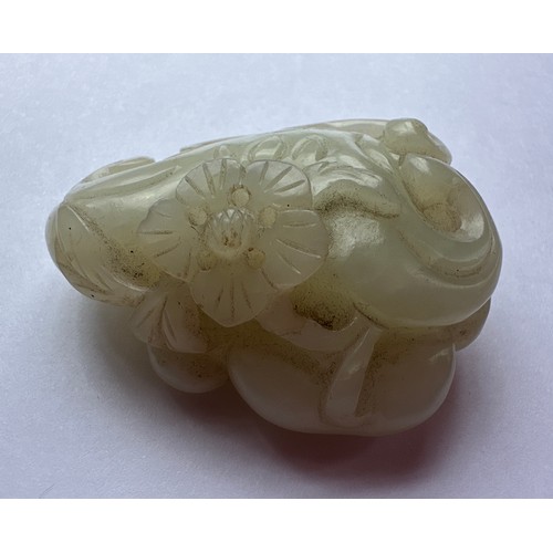 878 - A small jade group depicting catfish, probably Qing dynasty. 5 x 5.5cm.