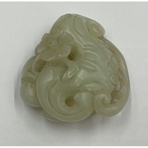 878 - A small jade group depicting catfish, probably Qing dynasty. 5 x 5.5cm.