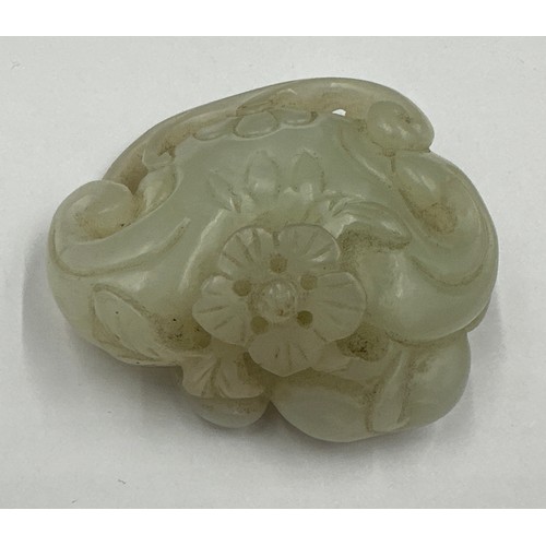 878 - A small jade group depicting catfish, probably Qing dynasty. 5 x 5.5cm.