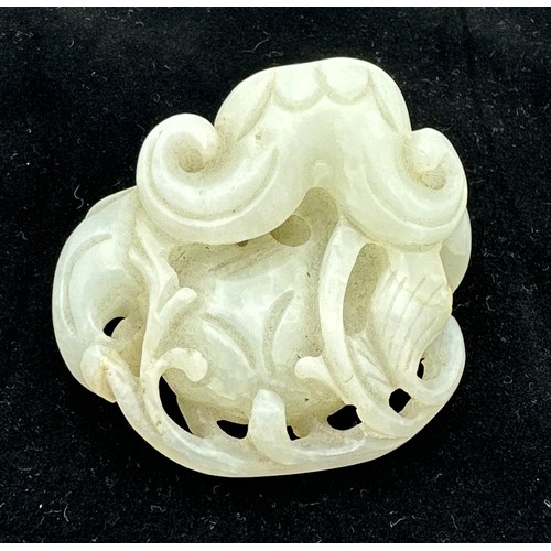 878 - A small jade group depicting catfish, probably Qing dynasty. 5 x 5.5cm.