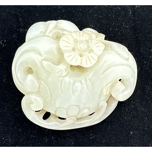 878 - A small jade group depicting catfish, probably Qing dynasty. 5 x 5.5cm.