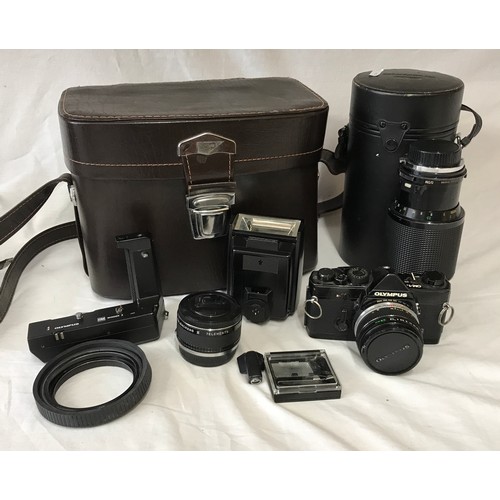 867 - A Olympus MD OM-1N camera with attached Zukio 28mm lens No.226311 along with a Vivitar series 1 70-1... 