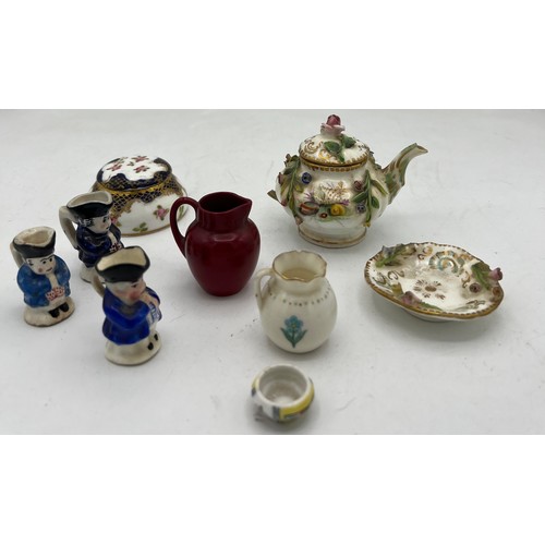 300 - A quantity of miniature ceramics to include Crown Staffordshire Toby jug, Limoges dish, Doulton Flam... 