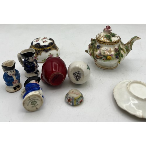 300 - A quantity of miniature ceramics to include Crown Staffordshire Toby jug, Limoges dish, Doulton Flam... 