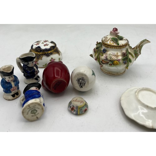 300 - A quantity of miniature ceramics to include Crown Staffordshire Toby jug, Limoges dish, Doulton Flam... 