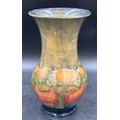 A  Moorcroft Pottery vase in the 'Eventide' pattern designed by William Moorcroft signed to base 24.... 