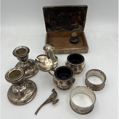 847 - A quantity of hallmarked silver to include two napkin rings, three piece cruet, weighted candlestick... 