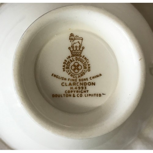 310 - A Royal Doulton dinner and tea service in the Clarendon pattern H4993 to include 8x dinner, 8x side ... 