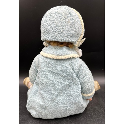 929 - An Armand Marseille 1330 bisque headed doll in vintage clothing with blue sleeping lashed eyes and t... 