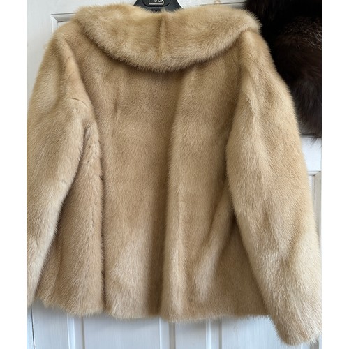 1074 - A brown mink coat approx. shoulder to hem 100cm from underarm to underarm 51cm and a pale mink jacke... 