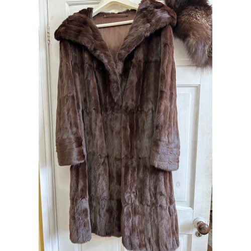 1074 - A brown mink coat approx. shoulder to hem 100cm from underarm to underarm 51cm and a pale mink jacke... 