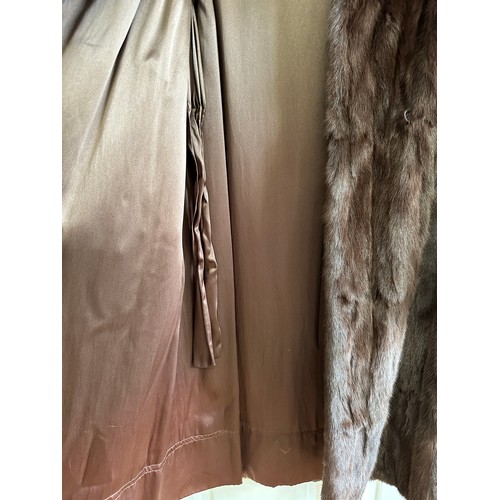 1074 - A brown mink coat approx. shoulder to hem 100cm from underarm to underarm 51cm and a pale mink jacke... 