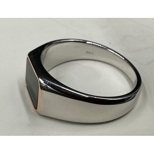 454 - A sterling silver Clogau signet ring with onyx surrounded with 9ct rose gold total weight 6.2gms siz... 