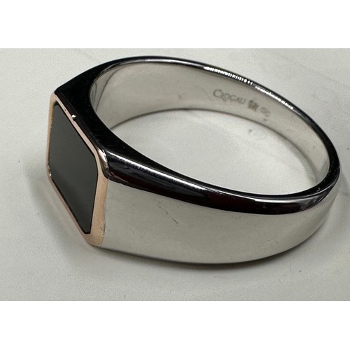 454 - A sterling silver Clogau signet ring with onyx surrounded with 9ct rose gold total weight 6.2gms siz... 