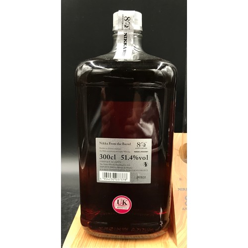 716 - A bottle of Nikka whisky from the Barrel 3000ml celebrating the 80th anniversary on wooden display s... 