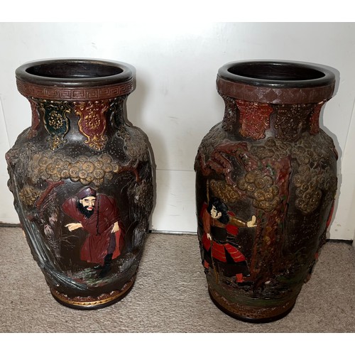 880 - A pair of late 19thC/early 20thC Japanese terracotta vases 39cm h.