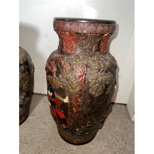 880 - A pair of late 19thC/early 20thC Japanese terracotta vases 39cm h.