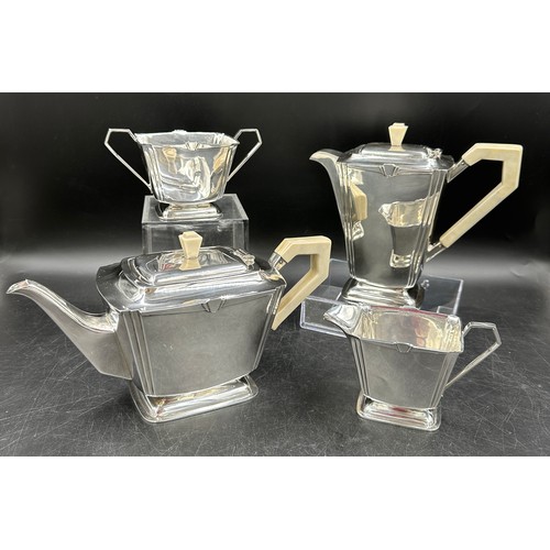 850 - A silver Art Deco four piece tea set comprising of coffee pot, teapot, twin handled sugar and jug al... 