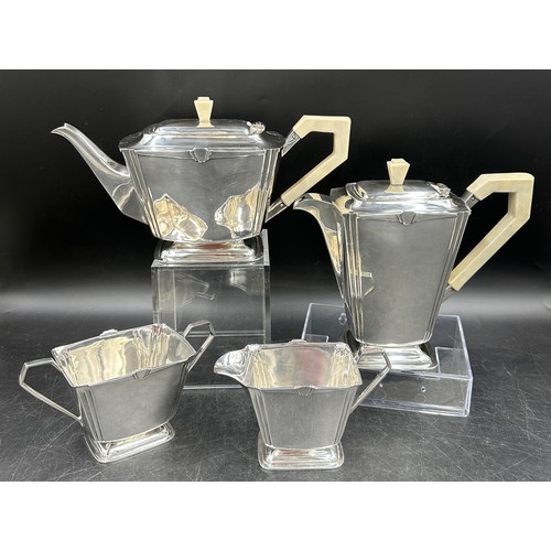 850 - A silver Art Deco four piece tea set comprising of coffee pot, teapot, twin handled sugar and jug al... 