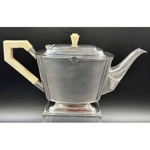 850 - A silver Art Deco four piece tea set comprising of coffee pot, teapot, twin handled sugar and jug al... 