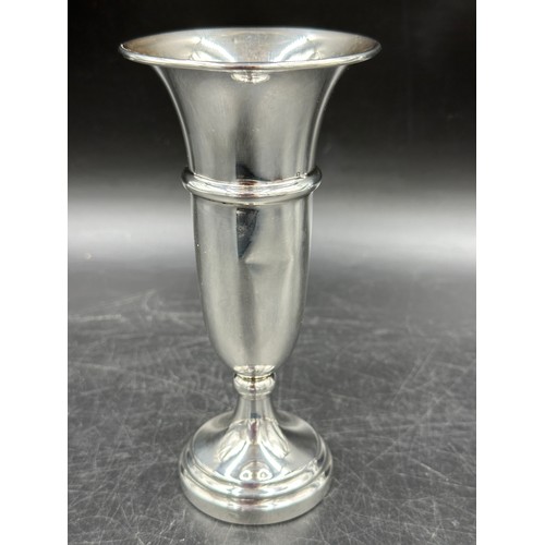 852 - A silver hallmarked egg cup Birmingham 1945 Joseph Gloster Ltd engraved T.F.D. 23.3gms, a weighted s... 