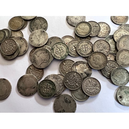 674 - A collection of coins to include mostly pre 1940 threepences, post 1940 sixpences and various other ... 