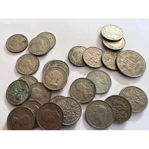 674 - A collection of coins to include mostly pre 1940 threepences, post 1940 sixpences and various other ... 