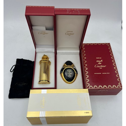 1213 - Boxed Cartier scent bottles to include unopened parfum ‘Must’ 50 ml, ‘ Panthère’ empty bottle and a ... 