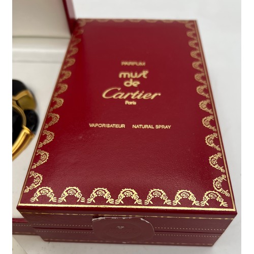 1213 - Boxed Cartier scent bottles to include unopened parfum ‘Must’ 50 ml, ‘ Panthère’ empty bottle and a ... 