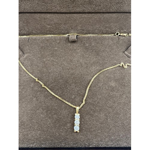 455 - An 18 carat gold chain necklace with three stone diamond pendant drop. Total weight 4gm. Length of c... 