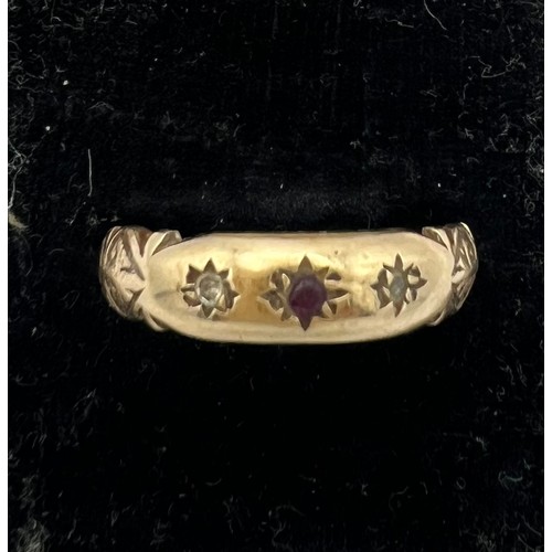 458 - A 9 carat gold ring set with clear and red stone. Size R. Weight 2.6gm.