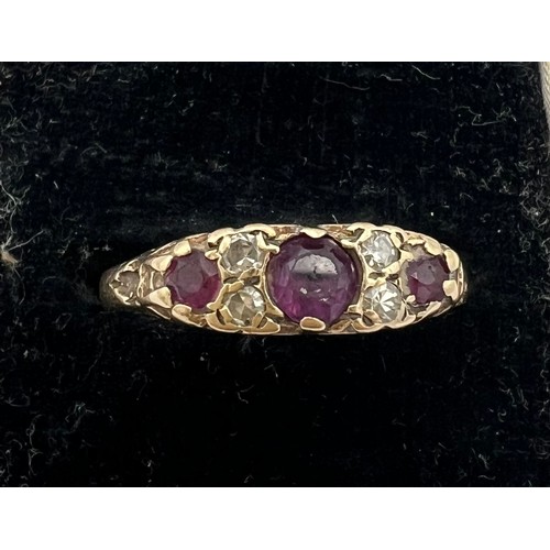 460 - A 9 carat gold ring set with garnets and diamonds. Size Q. Weight 1.9gm.