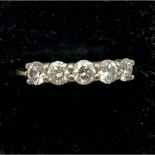 461 - A five stone diamond ring set in 18 carat yellow gold. Size M/N, weight 3gm.