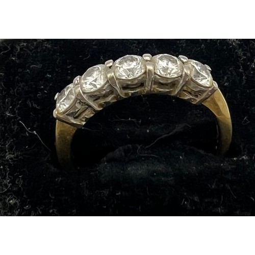 461 - A five stone diamond ring set in 18 carat yellow gold. Size M/N, weight 3gm.