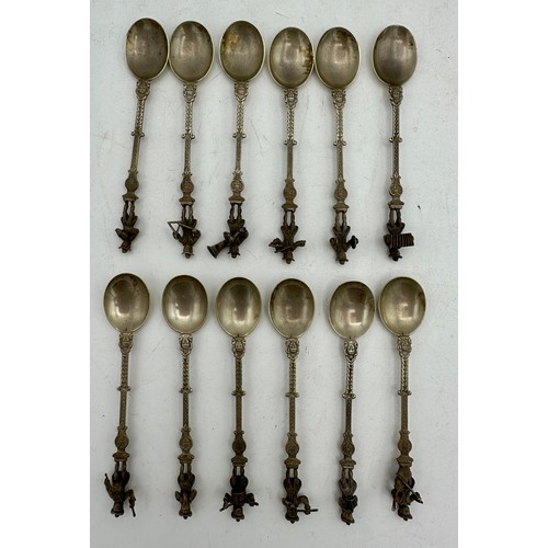 853 - A set of twelve figural orchestral spoons from Niekerk, Holland. Total weight 180gms.