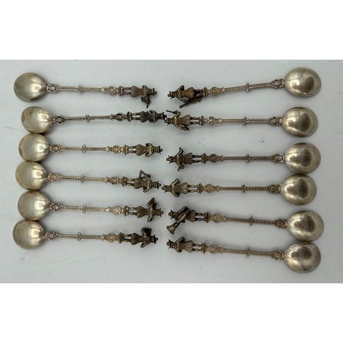 853 - A set of twelve figural orchestral spoons from Niekerk, Holland. Total weight 180gms.