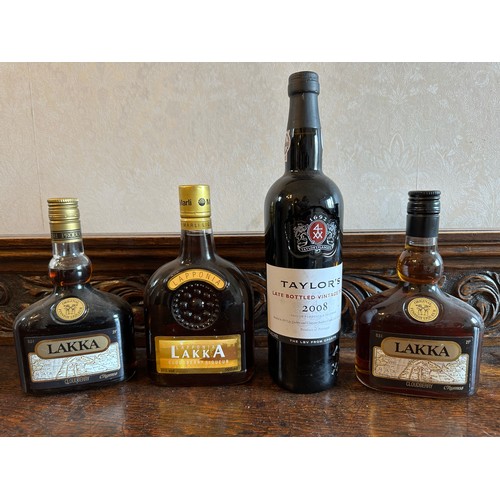 717 - A collection of bottles to include Taylor's 2008 vintage port and three Lakka cloudberry bottles.