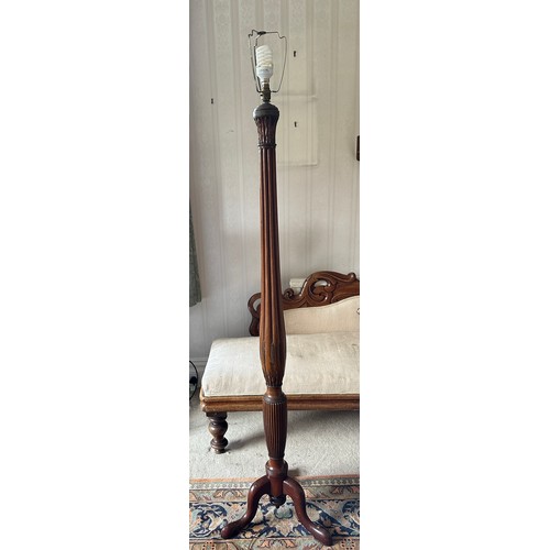 760 - A mahogany standard lamp on tripod base with reeded and wheatsheaf decoration. 173cm h to top of fit... 